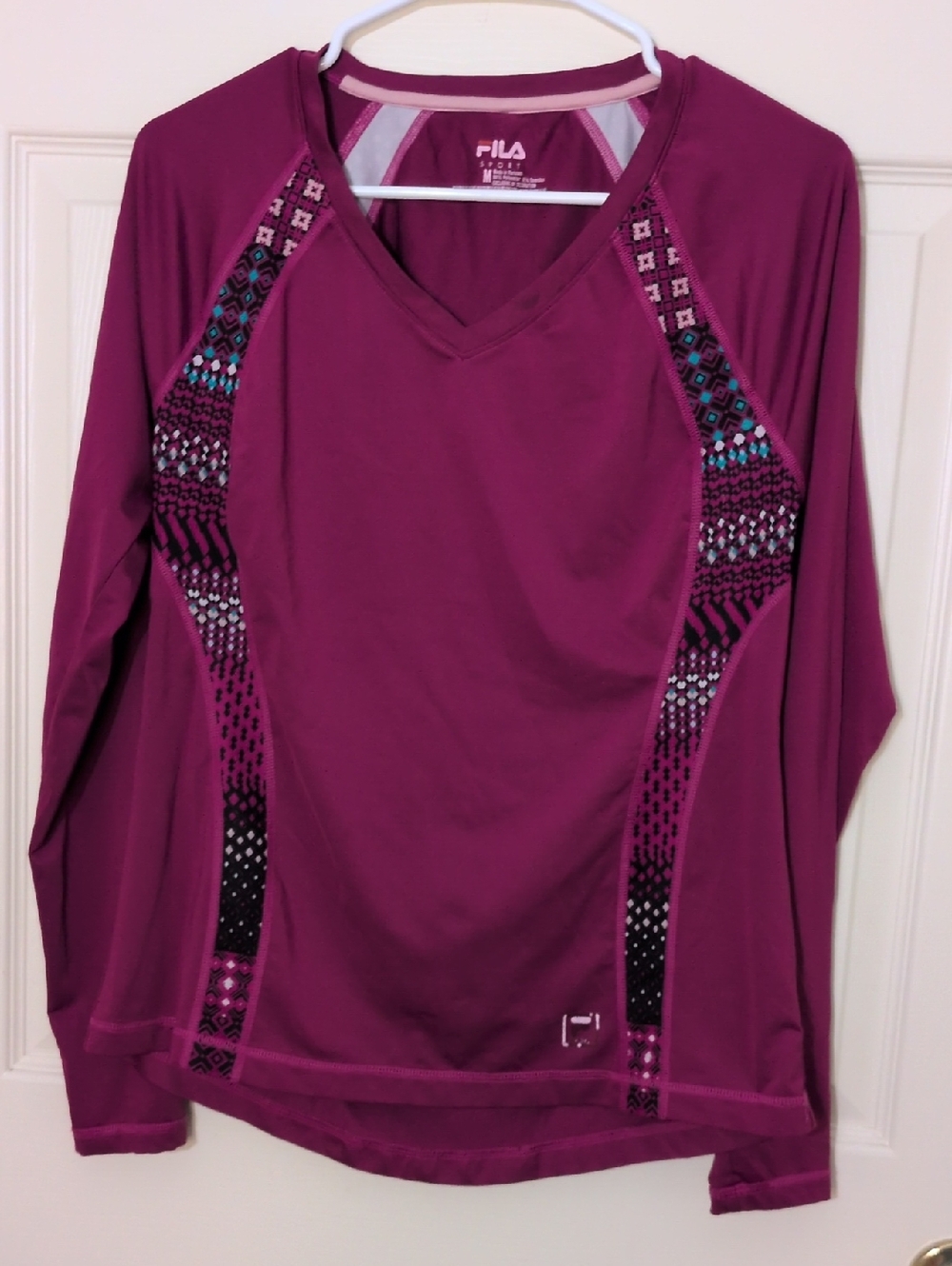 Fila Women's Berry/Purple V-Neck Long Sleeve Athletic Top with Patterned Panels.